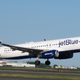 A jetBlue aircraft takes off
